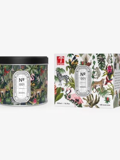 Bougie dans un pot rond en métal illustré pr.ésenté à côté de sa boite en carton décorée de dessins